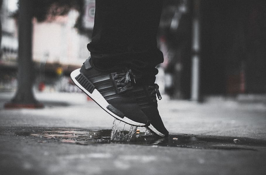 Grayscale Photo of Person Wearing Adidas Nmd Jumping on Puddle, HD wallpaper