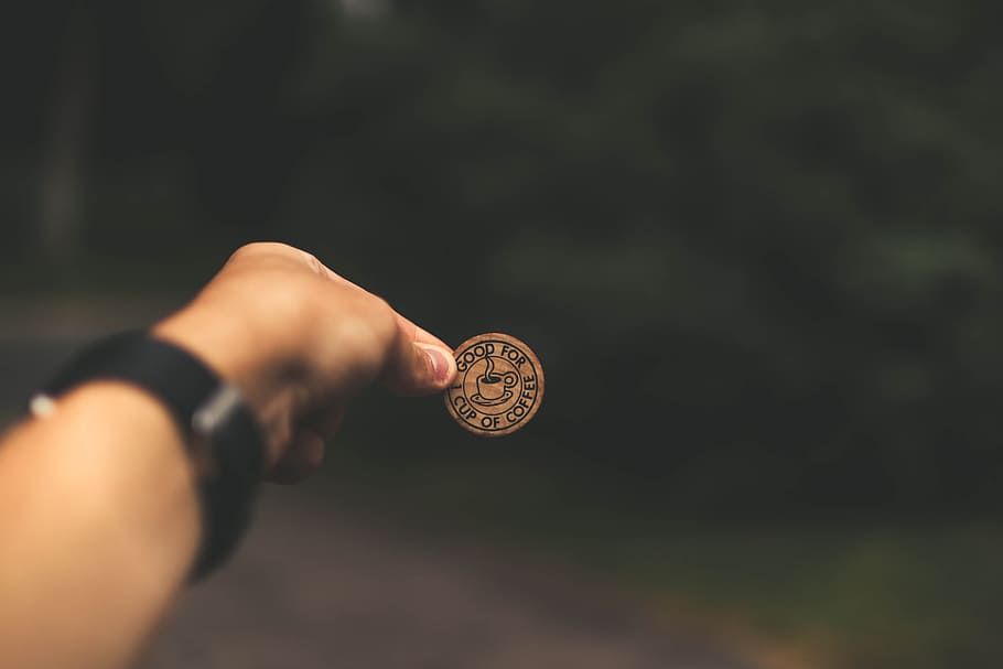 selective focus photography of man holding coin, label, hand HD wallpaper