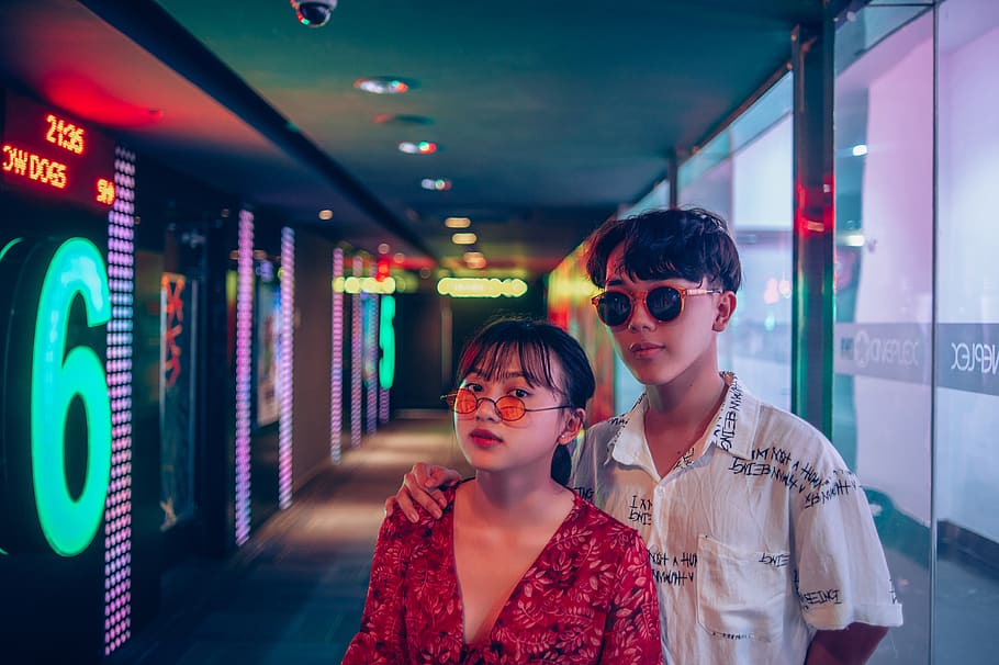 Two Man and Woman Wearing Sunglasses Inside Building, cinema