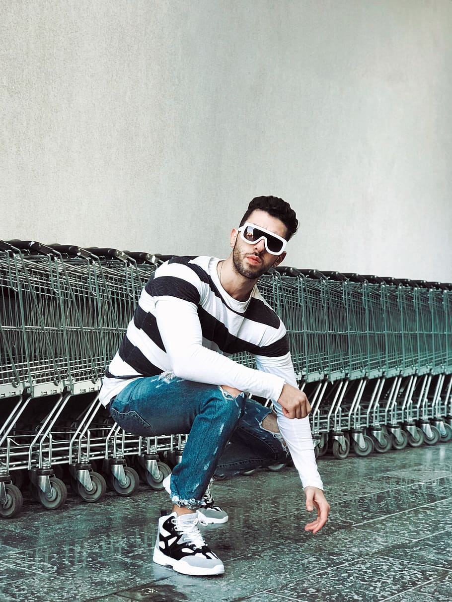 Photo of Man Squat Position in Front of Shopping Carts, fashionable, HD wallpaper