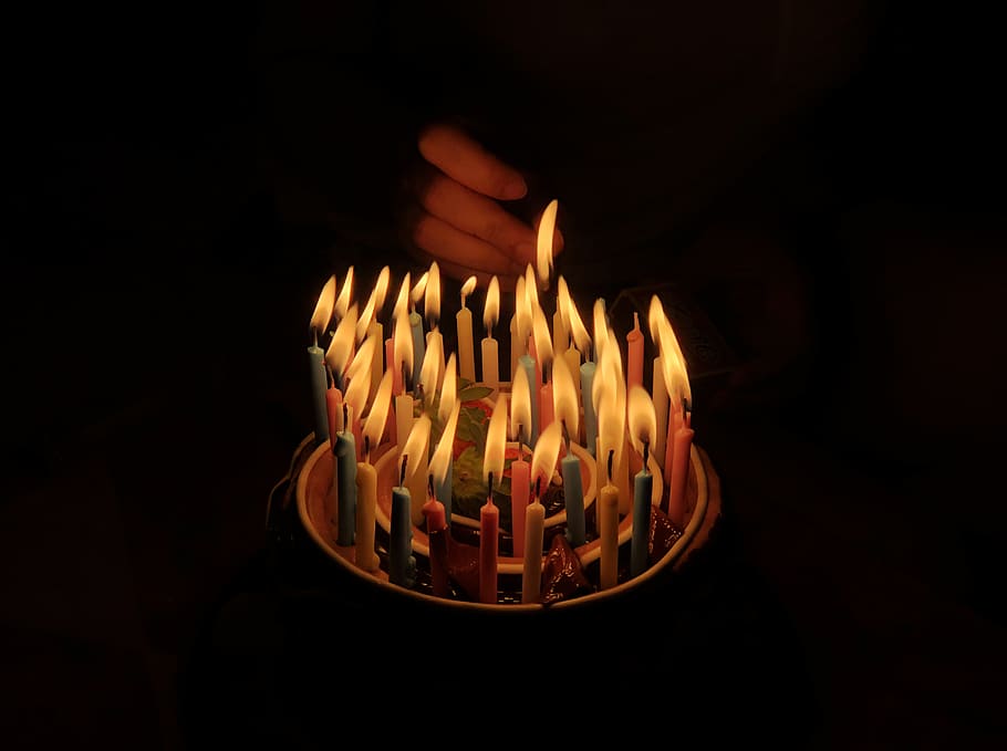 person touching assorted candles, fire, burning, flame, black background HD wallpaper