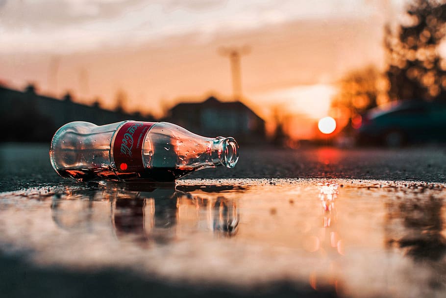 coca-cola bottle on grey pavement, beverage, drink, sun, moody