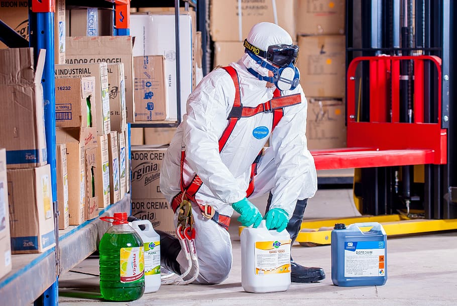 Person Wearing White Suit Holding White Container, action, adult