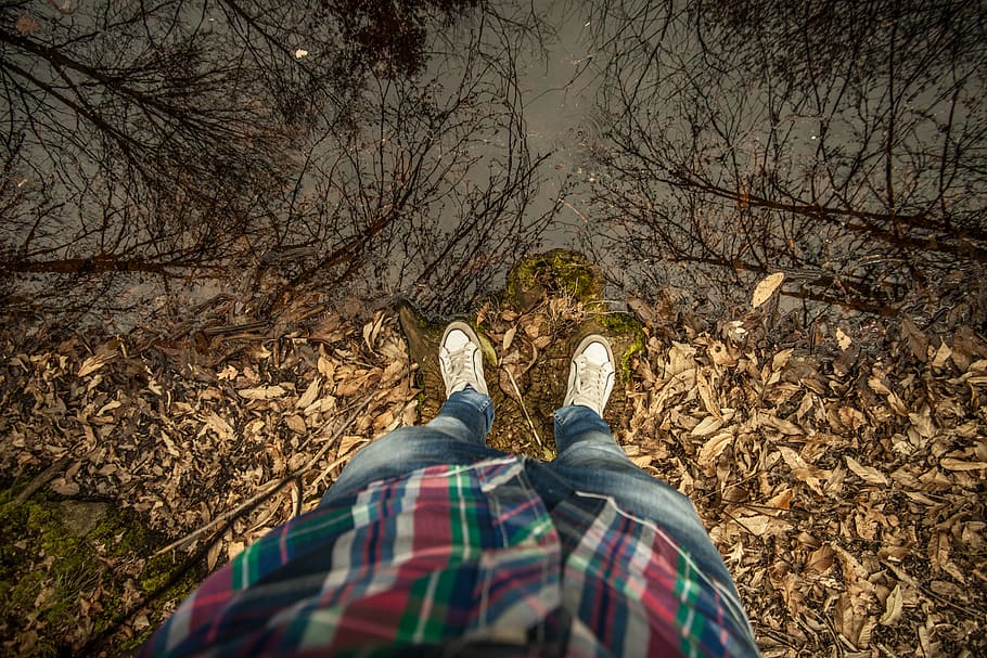 Person Stepping on Dried Leaves Near Body of Water, cliff, edge HD wallpaper