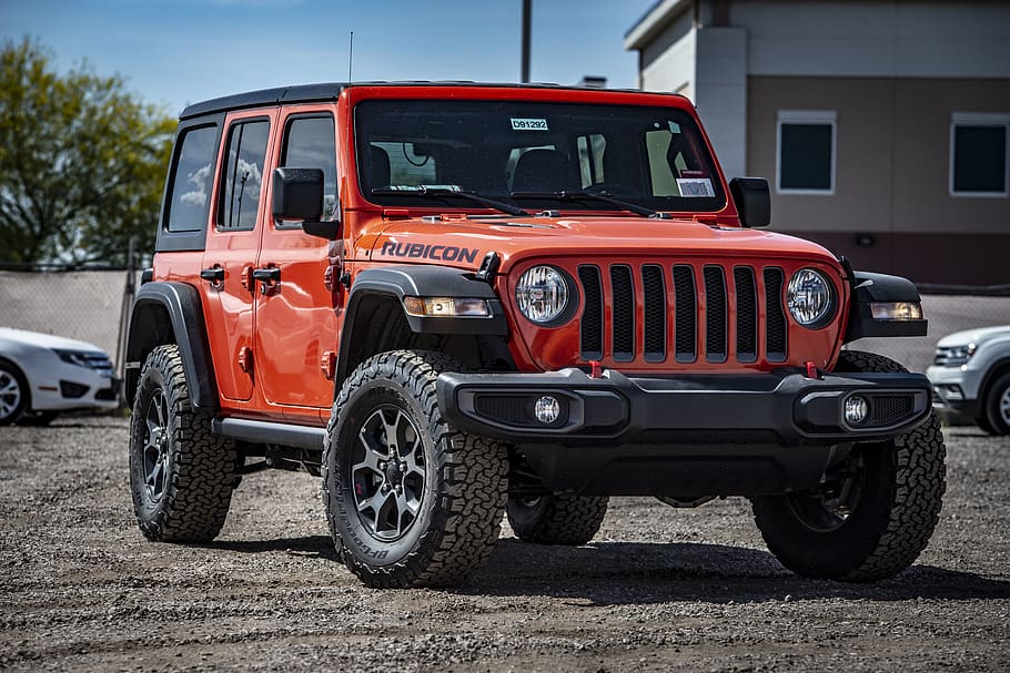 Photo of Red Rubicon Parked On Dirt Road, alloy rim, automobile