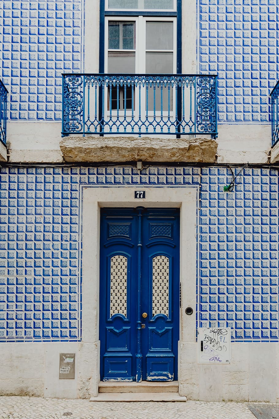 Colorful wooden door in the facade of a typical Portuguese house at Lisbon, Portugal