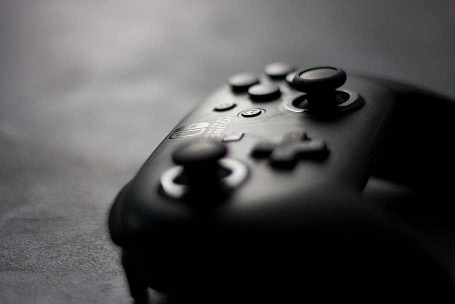 black Nintendo controller on black surface, head, close-up, selective focus HD wallpaper