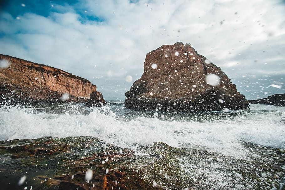 brown and black rocks, water, motion, sea, sky, splashing, beauty in nature HD wallpaper