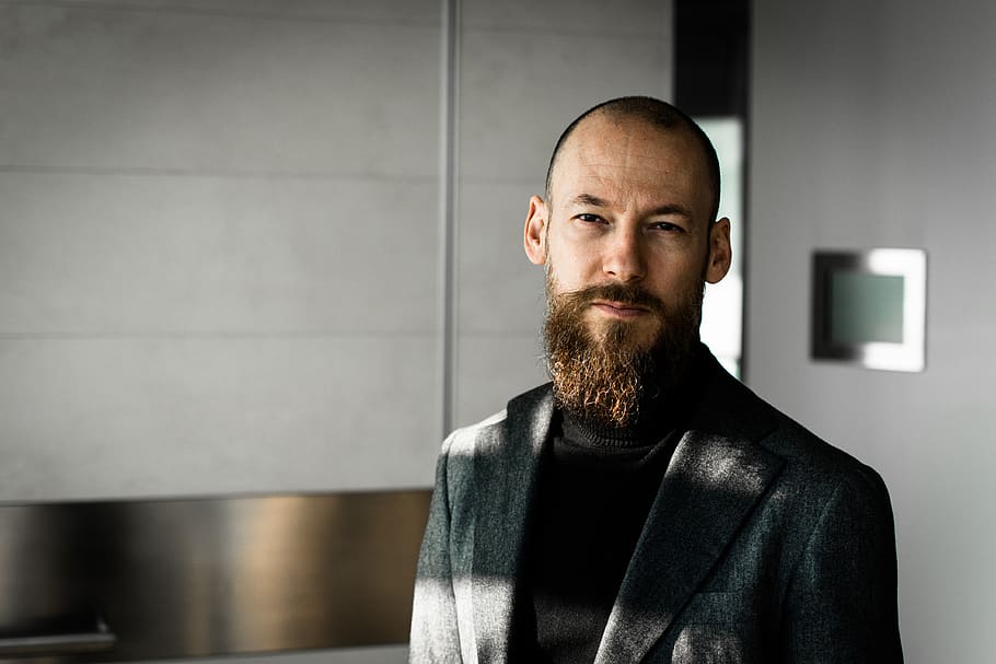 man wearing black blazer, beard, facial hair, one person, indoors HD wallpaper