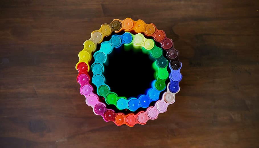 rainbow color chain on brown surface, multi colored, indoors HD wallpaper