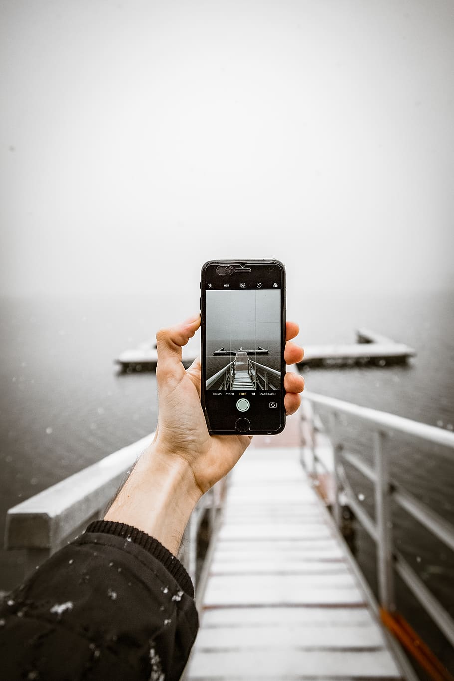 Person Taking a Photo of Dock, cellphone, cellular telephone.