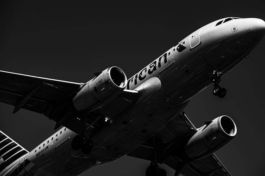 grayscale photo of white and black airliner, aircraft, transportation