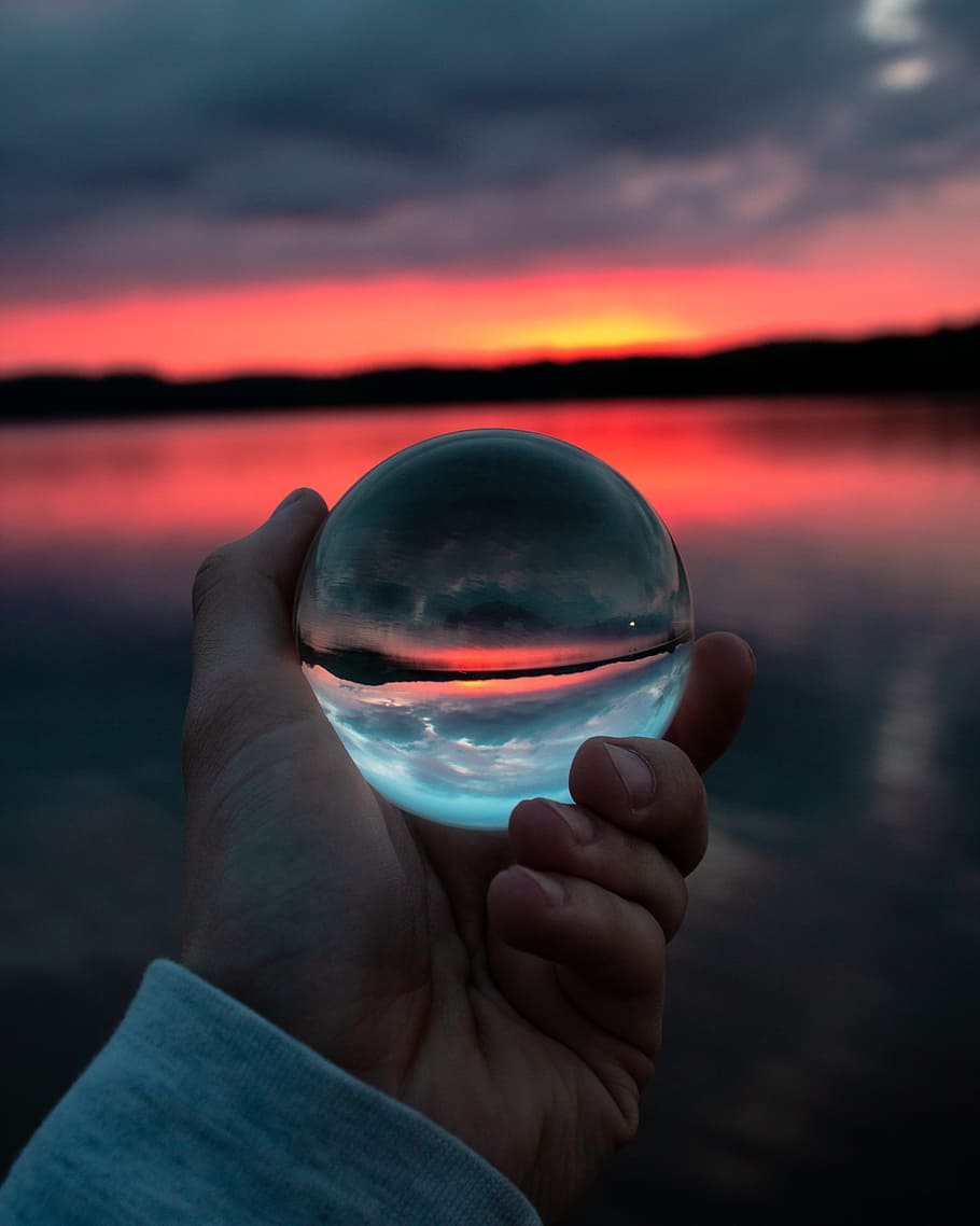 Person Holding Clear Glass Ball, clouds, cloudy skies, dusk, evening HD wallpaper