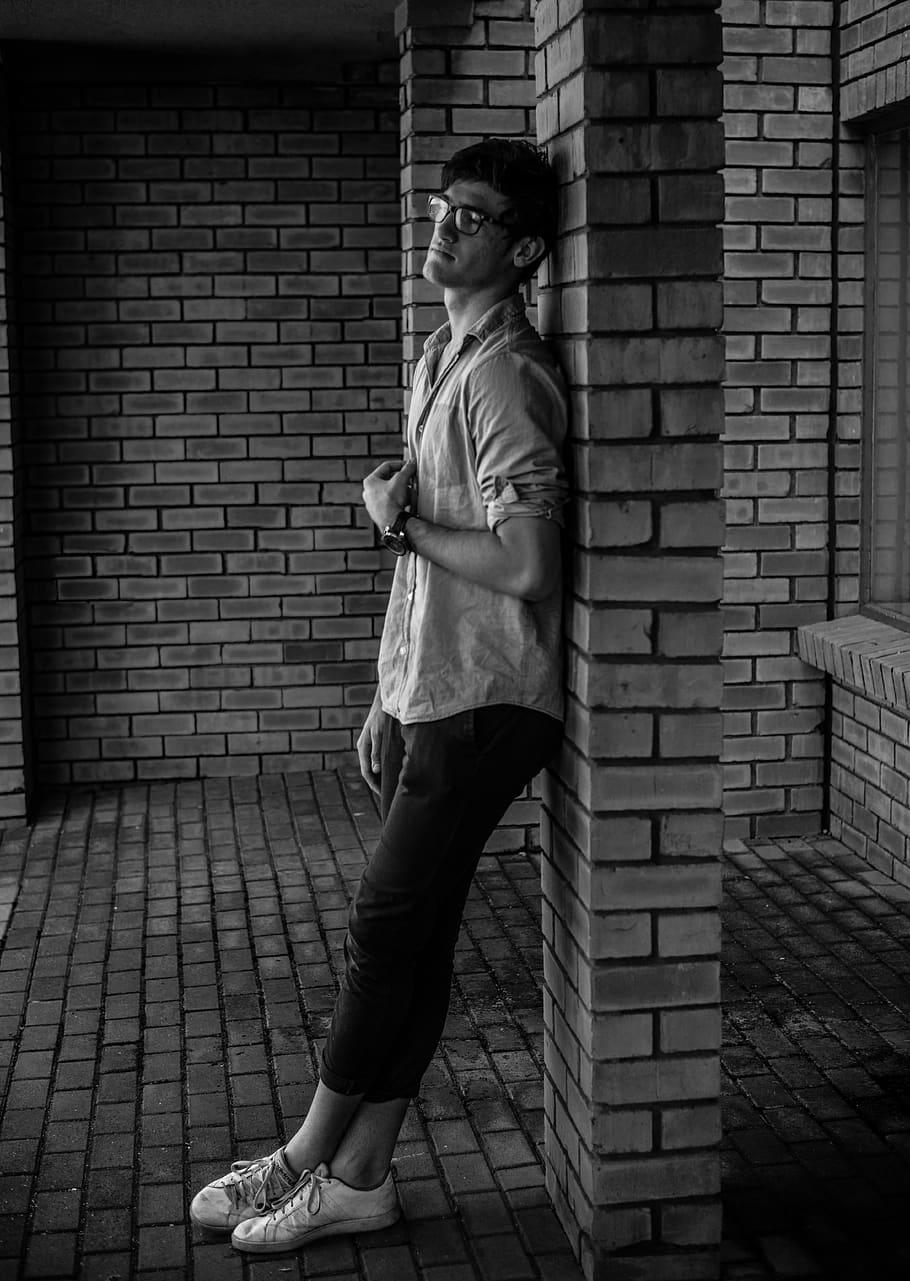 Photo of Man Leaning on Wall, adult, black-and-white, boy, bricks, HD wallpaper