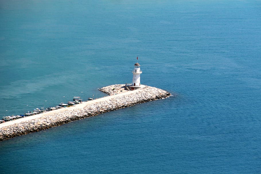 lighthouse surrounded by sea, water, architecture, guidance, built structure HD wallpaper