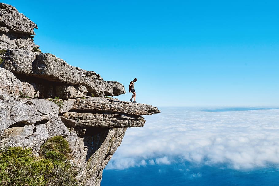 Man In Gray Tank Top, cliff, clouds, daylight, mountain, person HD wallpaper