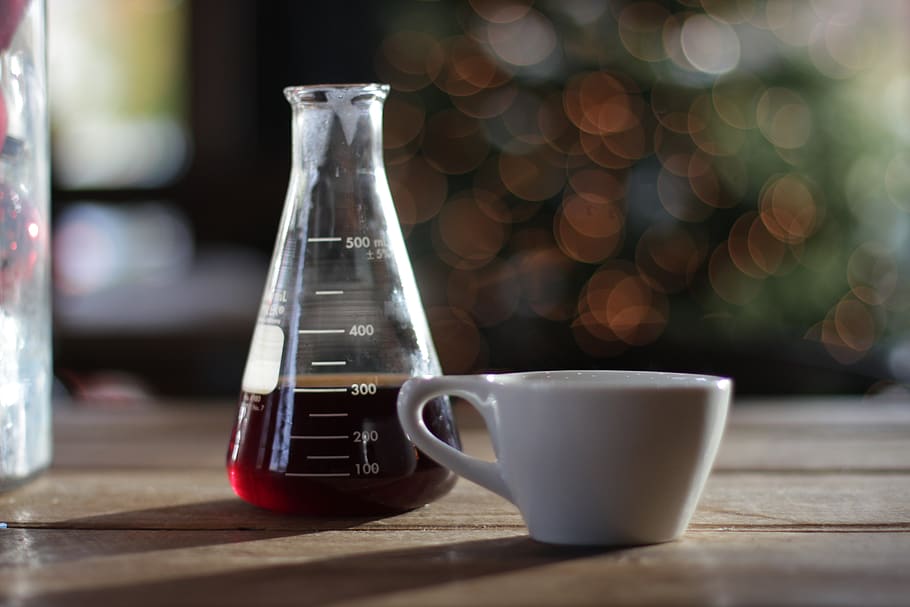 Erlenmeyer flask with bokeh lights, table, wood - material, cup HD wallpaper