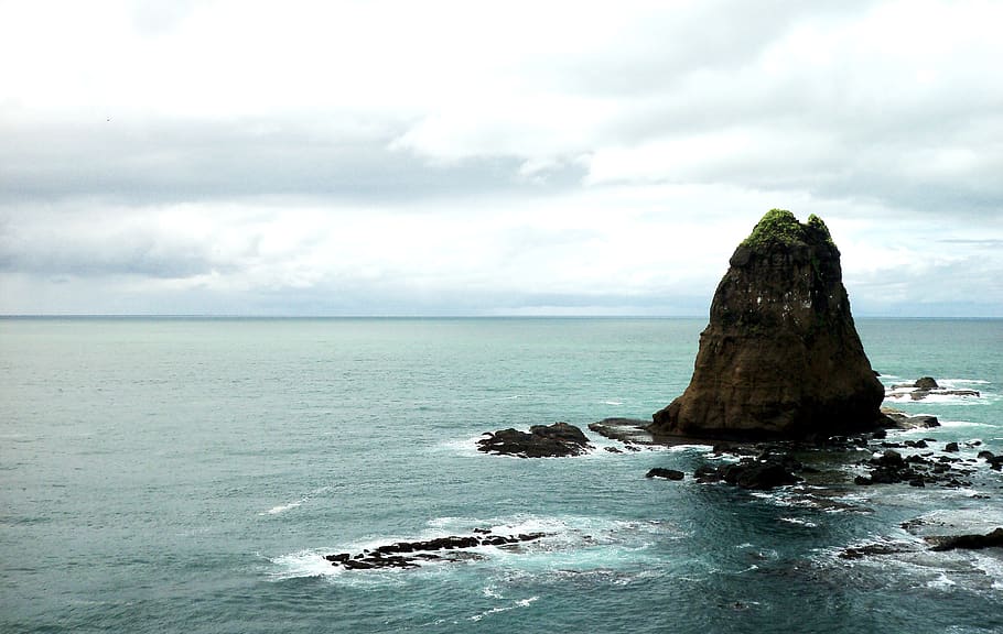 Photo of Brown Rock Formation in Body of Water, cliff, clouds HD wallpaper