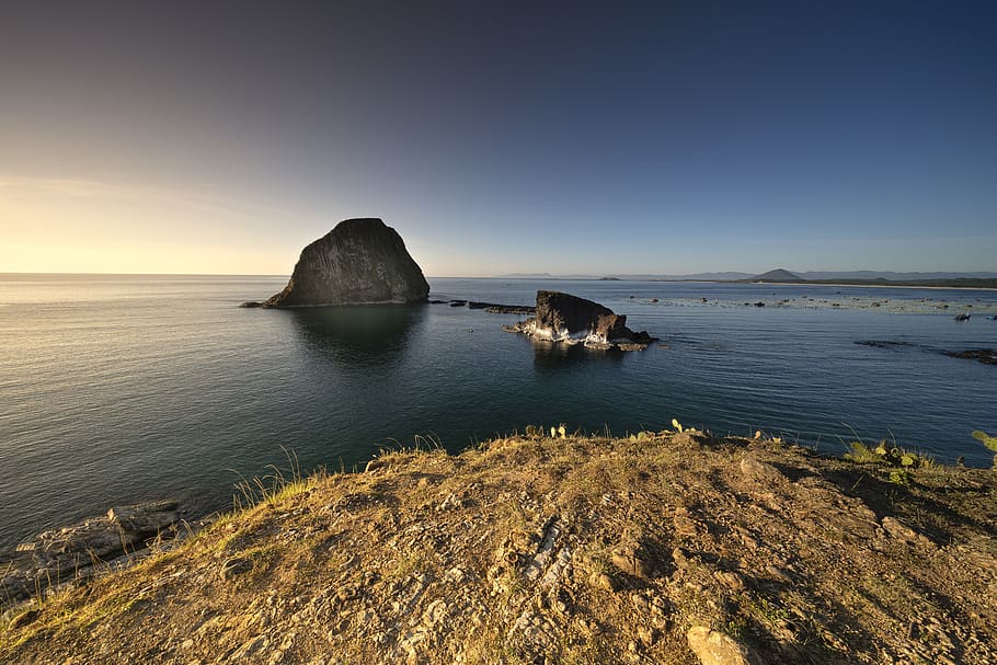 Rock Formation on Body of Water, beach, cliff, cliff coast, dawn HD wallpaper