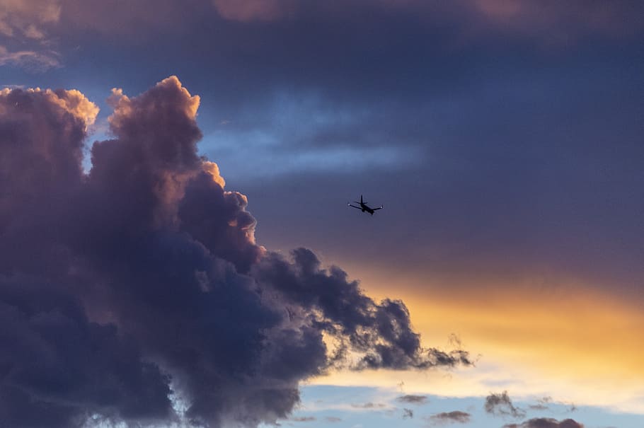 low-angle photography of plane near clouds, sky, sunlight, glow HD wallpaper