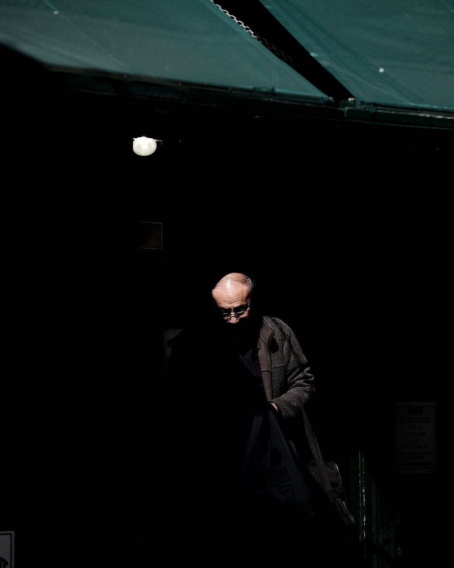 man wearing black jacket inside dark room, in shadow, emerge HD wallpaper