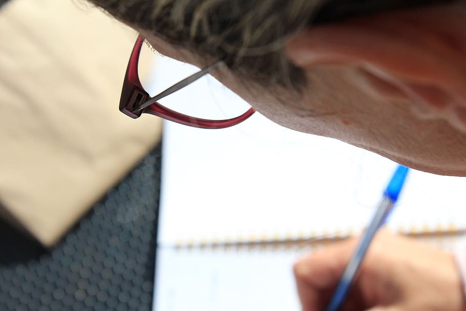 man writing on white book, orvieto, italy, face, dimples, person HD wallpaper