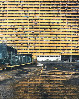yellow concrete building, reflection, urban, city, brutalist HD wallpaper