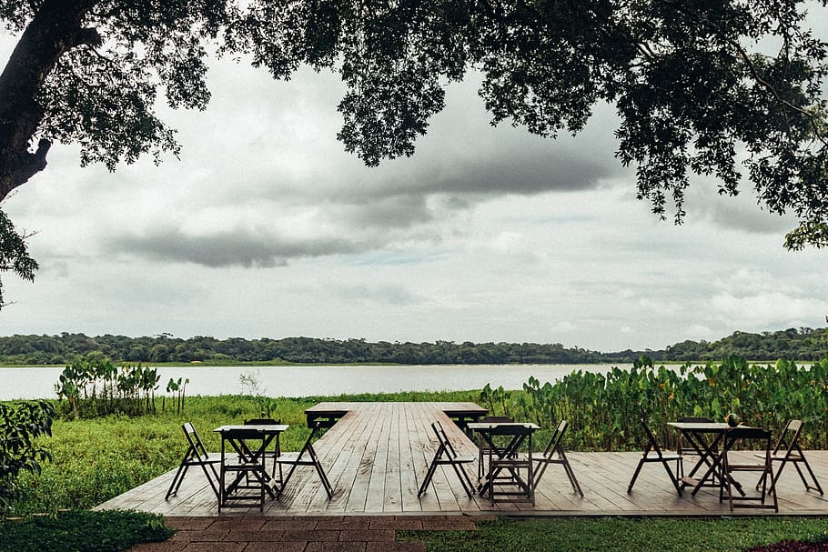 Black Chair and Tables Near Trees, chairs, clouds, daylight, environment HD wallpaper