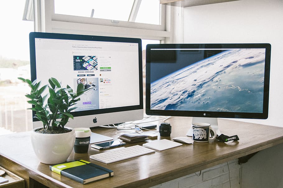 A dual monitor setup on a brown desk., work, workspace, vietnam, HD wallpaper