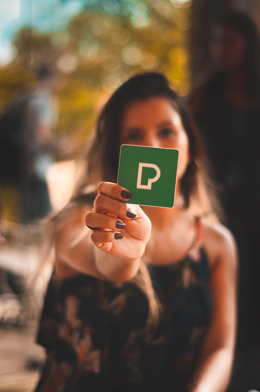 HD wallpaper: Person Holding Green P Card, blur, blurred background, depth of field - Wallpaper Flare