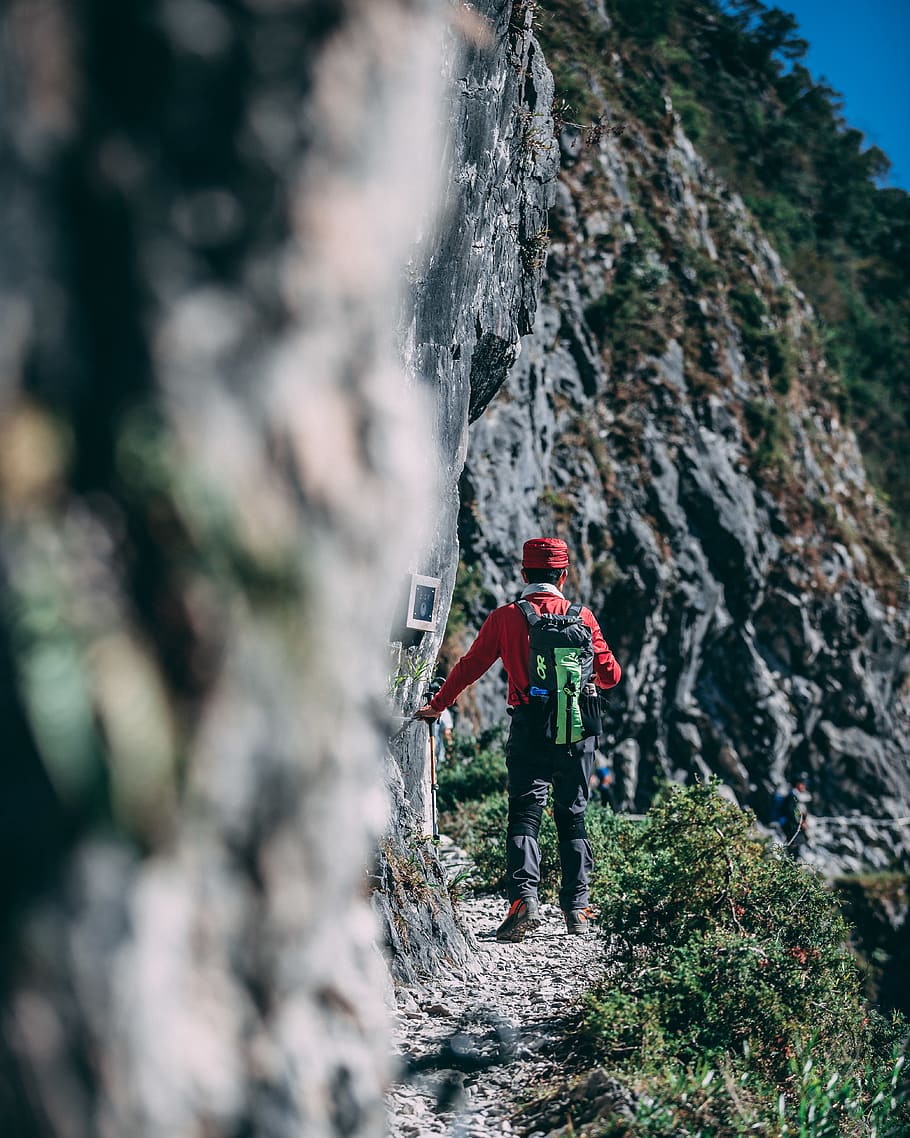 man walking near gray cliff, one person, full length, rock, mountain HD wallpaper