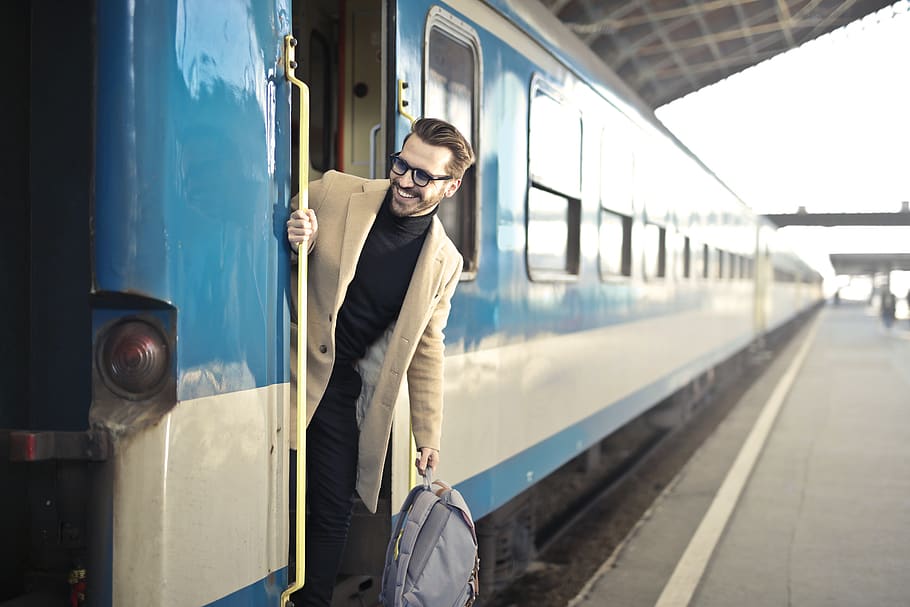 Man Wearing Beige Overcoat Inside Train, backpack, blur, commuter HD wallpaper