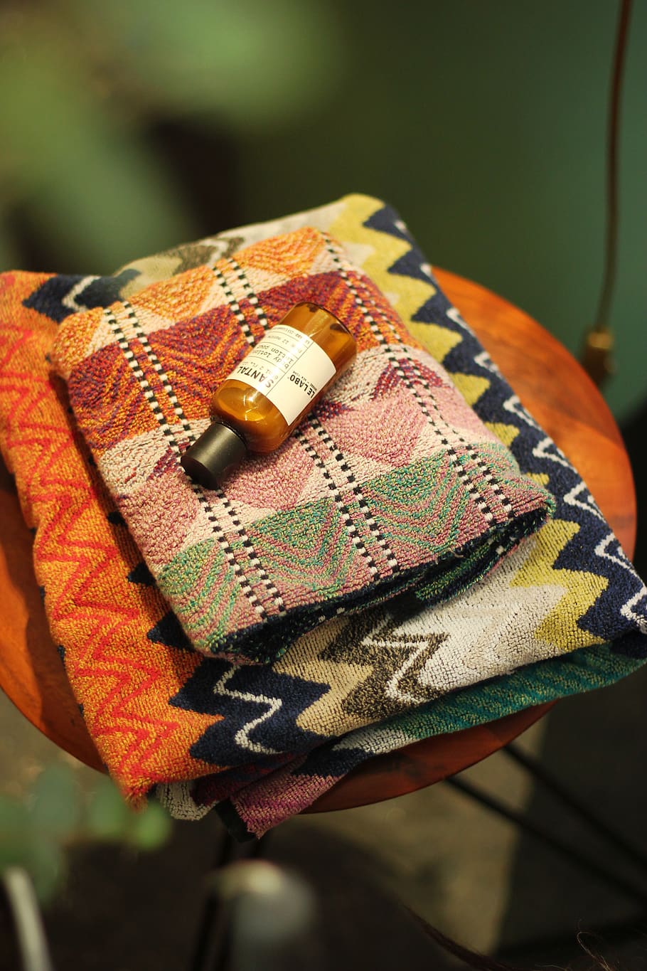 labeled bottle on blanket, focus on foreground, textile, close-up HD wallpaper