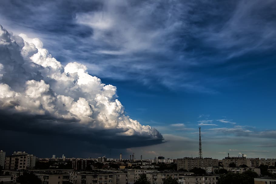 White Concrete High Rise Building Under Gray White Clouds during Daytime HD wallpaper