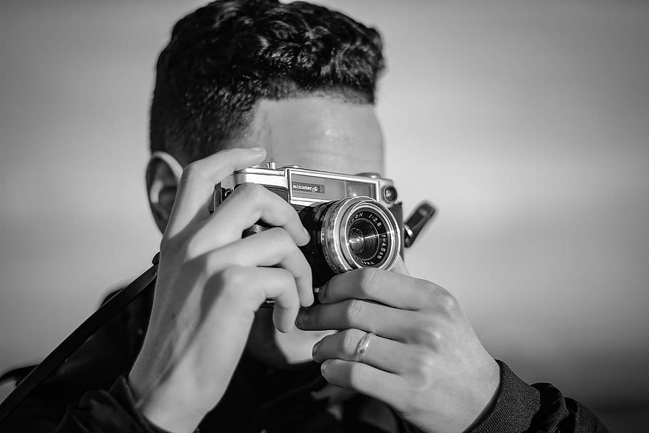 person holding SLR camera, man, male, hand, ring, taking picture HD wallpaper