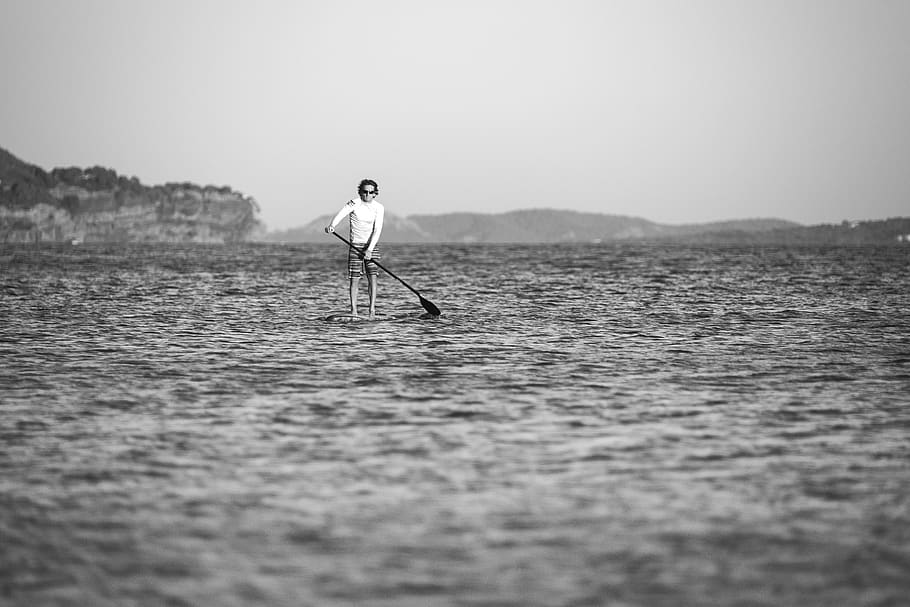 greyscale photo of man man on surfboard during daytime, water, HD wallpaper
