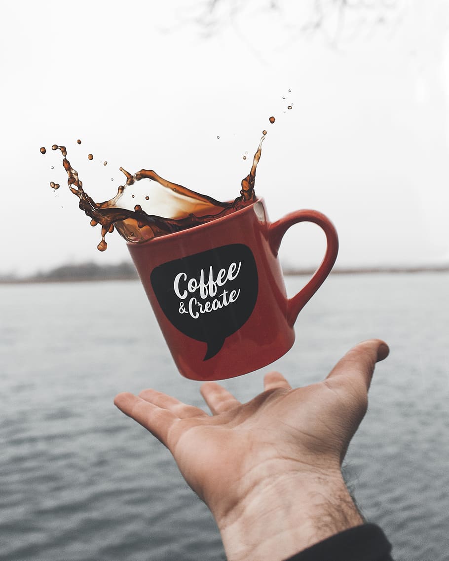 brown liquid filled brown ceramic mug, hand, human hand, holding HD wallpaper