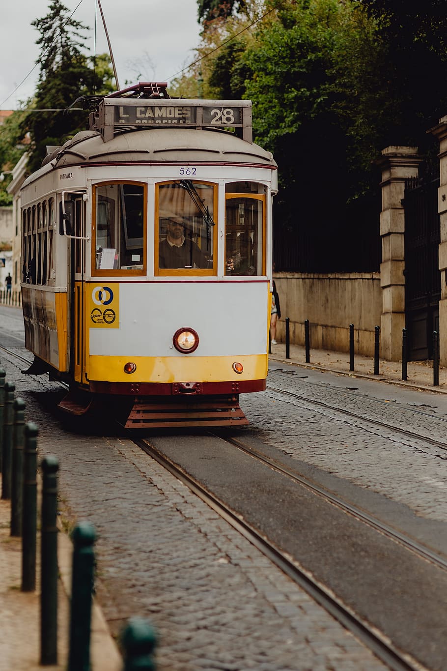Famous vintage yellow 28 tram on street of Lisbon, Portugal, old