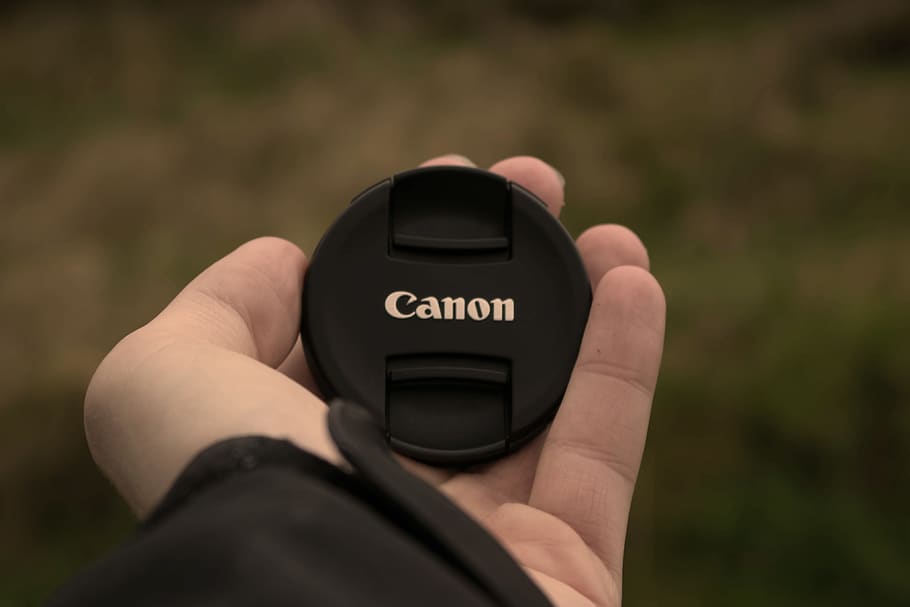 canon, lenscap, camera, human hand, one person, real people HD wallpaper