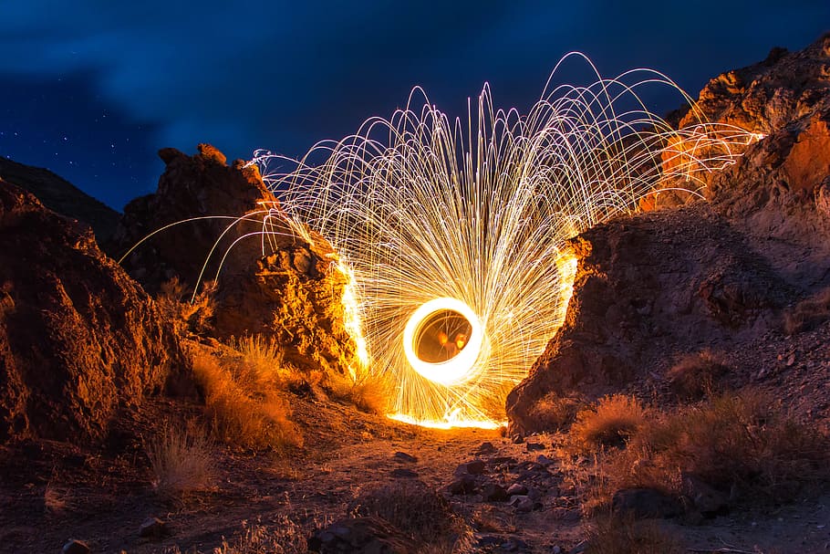 steelwool photography with between rocks, light, lightpainting HD wallpaper