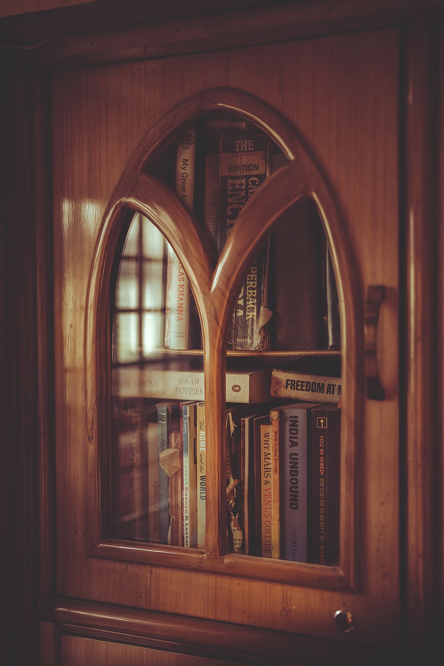 shallow-focus-photo-of-brown-wooden-display-cabinet.jpg