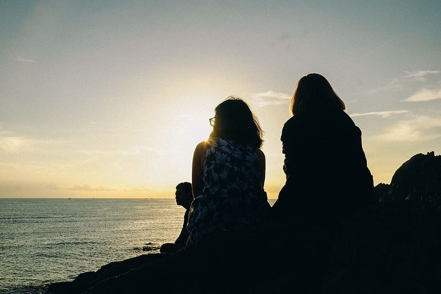 Silhouette of Two Women Facing Body of Water, clouds, dusk, evening HD wallpaper