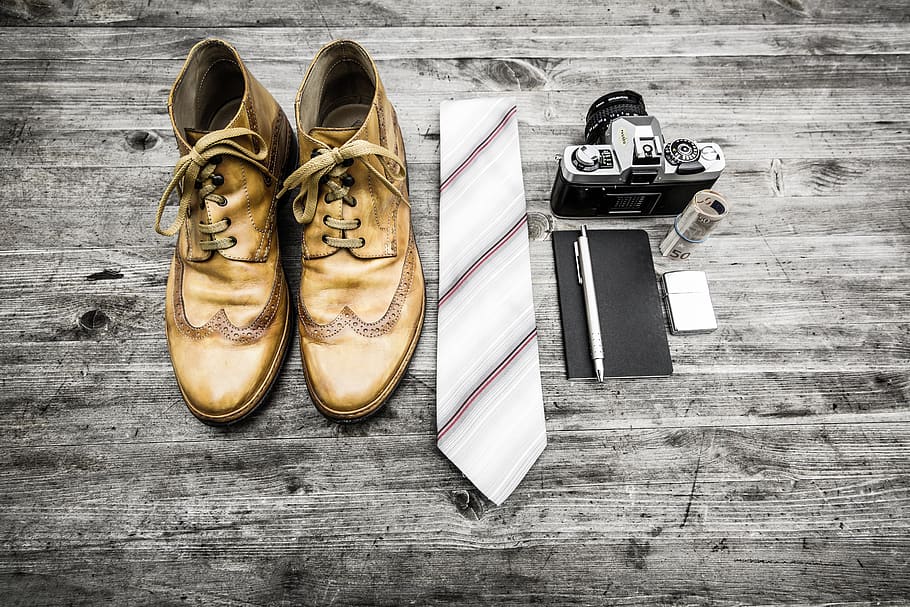pair of brown leather boots beside necktie next to pen, notebook, and MILC camera, HD wallpaper