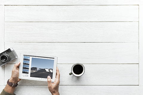 Person Using Tablet Computer Near Mug and Camera, background HD wallpaper