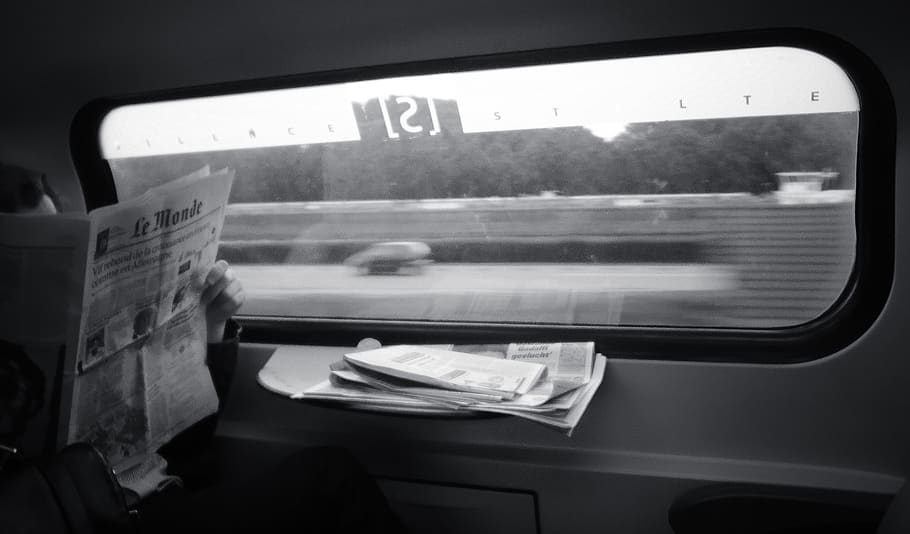 person reading newspaper, amsterdam, netherlands, grey, vehicle