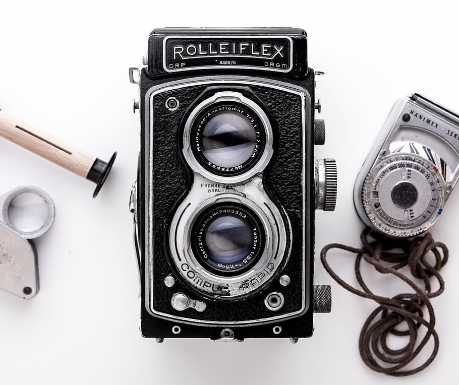 Black Rolleiflex Camera on White Surface, analog camera, antique