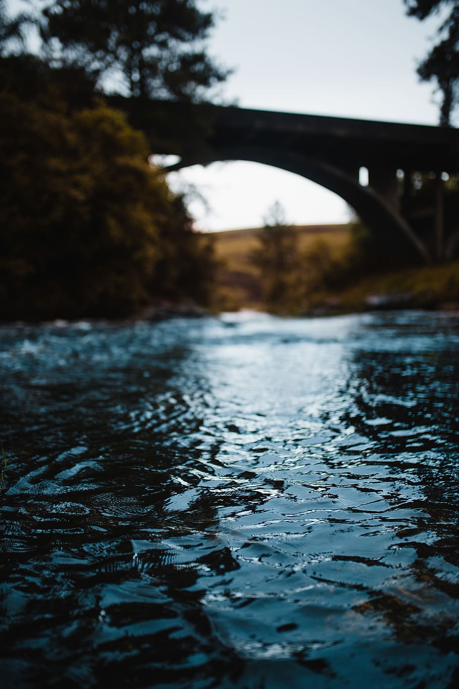Blue Calm Water, blurred background, bridge, daylight, flow, grass HD wallpaper
