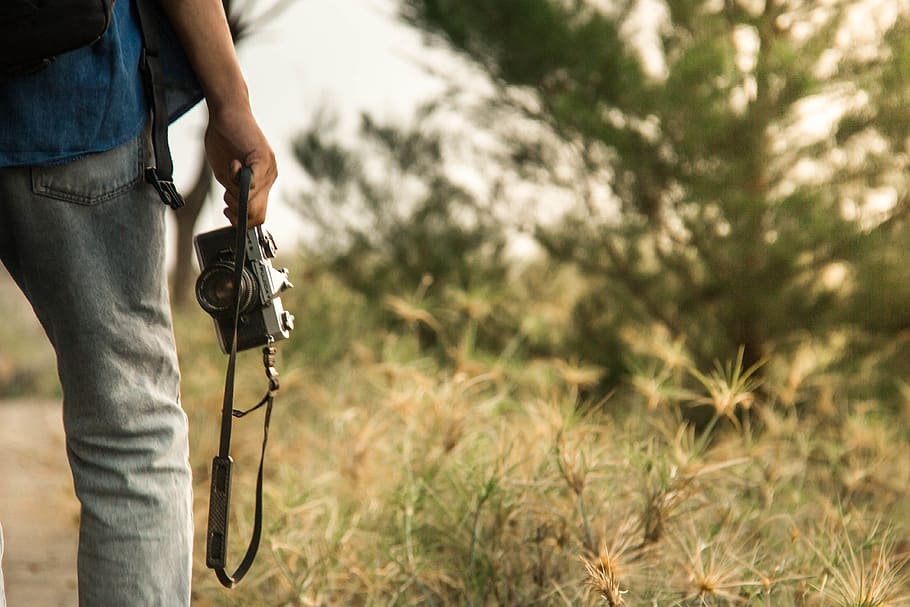 Person Holding a Camera, analog camera, camera lens, camera strap HD wallpaper
