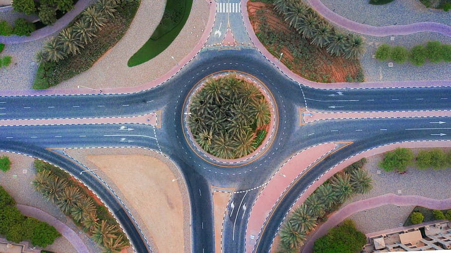 drone, road, desert, roundabout, palm tree, plants, cars, camera HD wallpaper