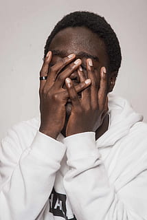 man touching his face, hair, human, person, afro hairstyle, finger HD wallpaper